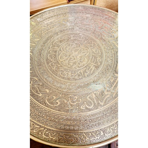 372 - Indian brass folding occasional circular table, carved circular occasional table with African decora... 