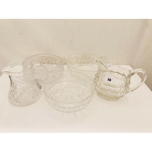 29 - Cut and moulded glassware comprising 3 fruit bowls and 2 water jugs