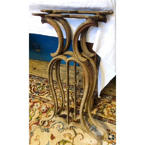 445 - Pair of decorative cast iron table legs