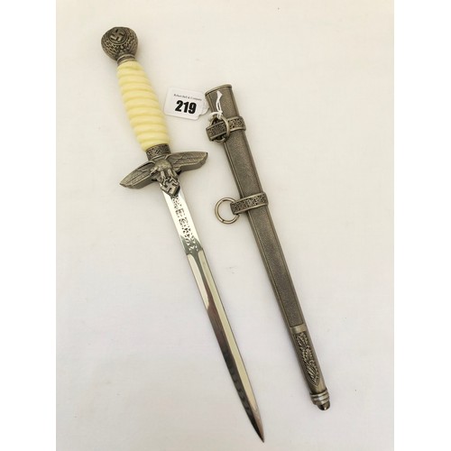 219 - A Third Reich WWII reproduction dress dagger, with white celluloid grip and scabbard