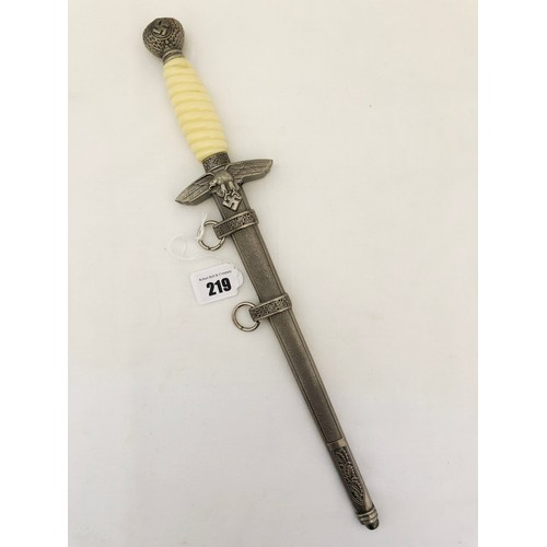 219 - A Third Reich WWII reproduction dress dagger, with white celluloid grip and scabbard