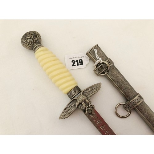 219 - A Third Reich WWII reproduction dress dagger, with white celluloid grip and scabbard