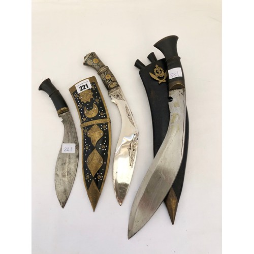 221 - An Indian Kukri with Gurkha Medical Corps badge 7 two smaller Indian knives, one with decorative sca... 