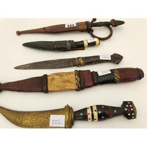 222 - A group of five 19th century eastern & Indian daggers, including leather and ornamental brass sheath... 