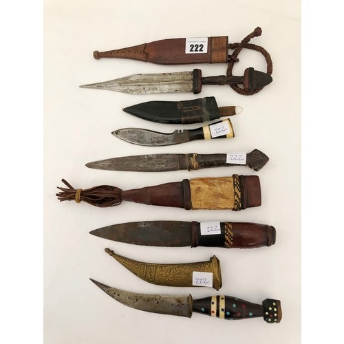 222 - A group of five 19th century eastern & Indian daggers, including leather and ornamental brass sheath... 