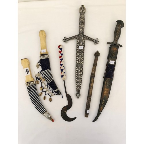 226 - A collection of six various daggers and weapons, including a Turkish sheathed Kard; Greek War of Ind... 