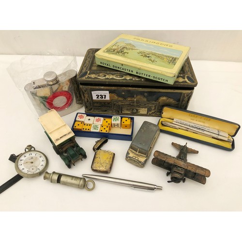 237 - Tin of various collectors items including Hudson and Co 1951 whistle, play worn toys etc