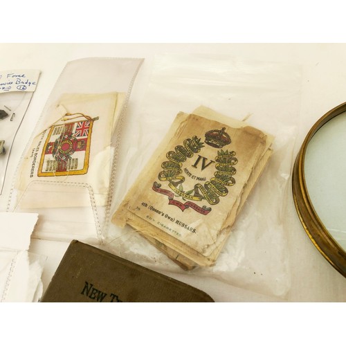 229 - A collectors lot, a collection of loose silks depicting British regimental badges; various WWI medal... 