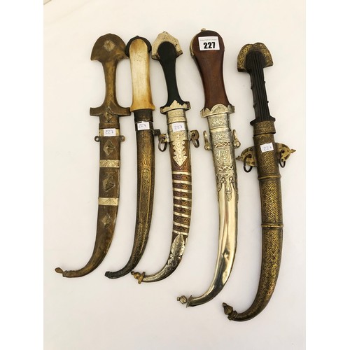 227 - A collection of five Indian jambiya daggers with sheaths