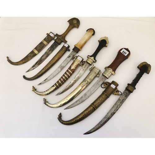 227 - A collection of five Indian jambiya daggers with sheaths