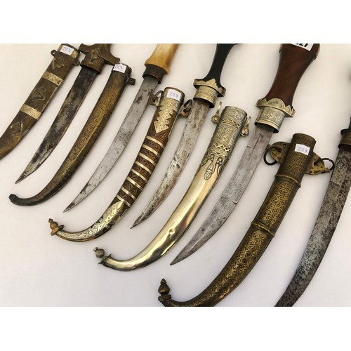 227 - A collection of five Indian jambiya daggers with sheaths