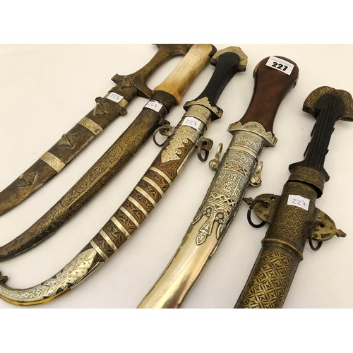 227 - A collection of five Indian jambiya daggers with sheaths