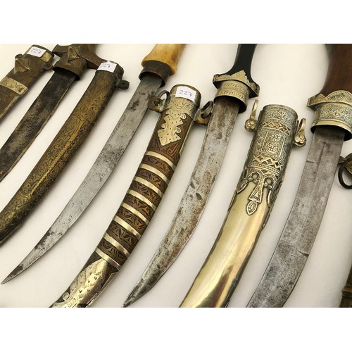 227 - A collection of five Indian jambiya daggers with sheaths