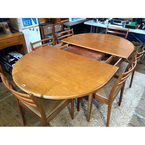 299 - Vintage G-Plan teak dining suite comprising extending D-ended table and six ladder back chairs with ... 