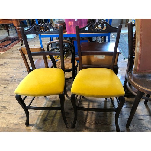 301 - Pair of Edwardian mahogany dining chairs with carved top rails