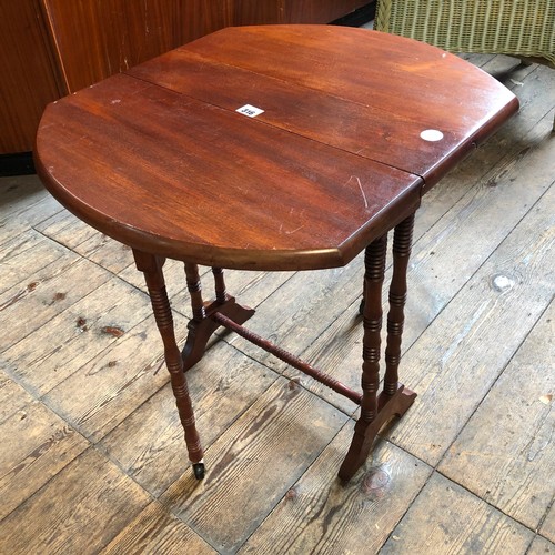 316 - Reproduction mahogany Sutherland table on turned supports