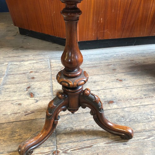 319 - Reproduction mahogany oval tilt top occasional table on decorative carved support