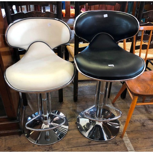 338 - Pair of cream and black chrome and faux leather bar stools