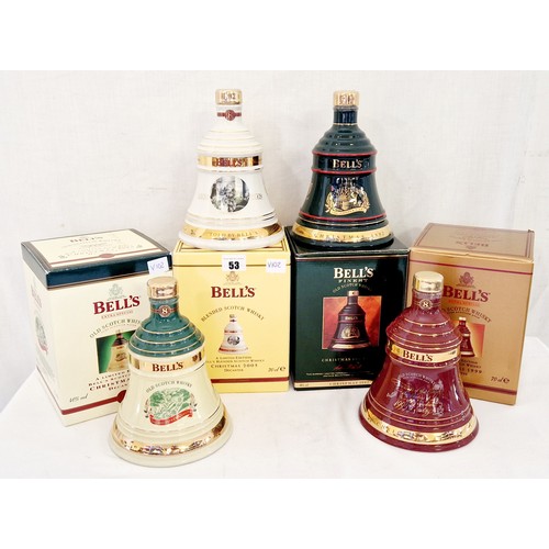 53 - 4 various commemorative boxed Bells Wade whiskey decanters