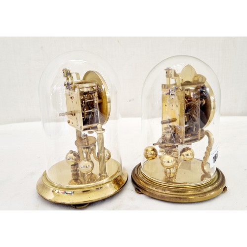 166 - Two glass domed clockwork mantel clocks