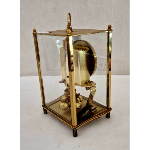 169 - Modern Kundo brass mantel clock in glass case