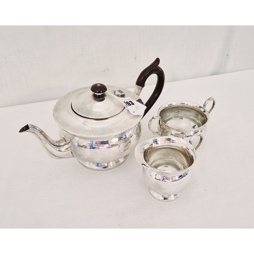 263 - A Birmingham 1931 three piece tea service comprising teapot, cream and sugar, on circular pedestal b... 