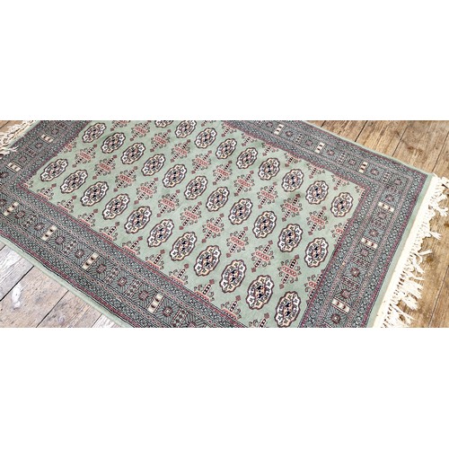 276 - Turkish green patterned woollen rug approx. 67