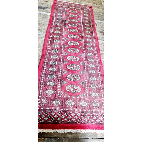 277 - Bokhara red woollen runner, 186 x 65 cm