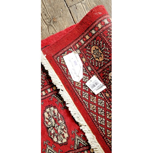 277 - Bokhara red woollen runner, 186 x 65 cm