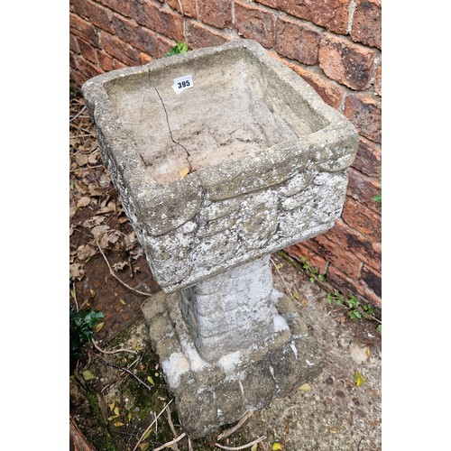 395 - Simulated stone planter on plinth