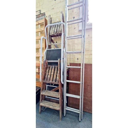 408 - Aluminium extending ladder, tubular steel step ladders and two pairs of wooden step ladders