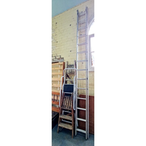 408 - Aluminium extending ladder, tubular steel step ladders and two pairs of wooden step ladders