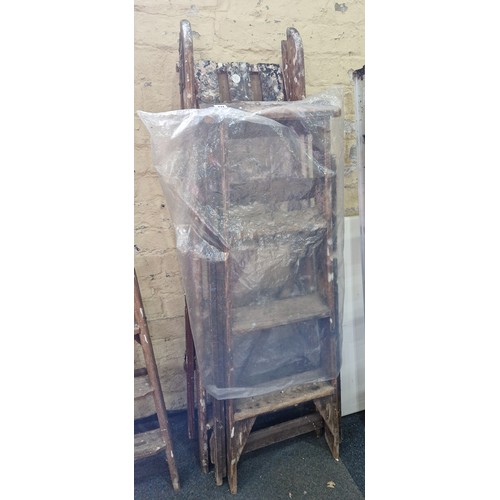 411 - Two pairs of wooden step ladders