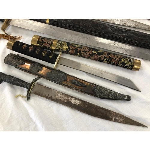 146 - Group of five assorted mainly eastern swords and knives etc, incl. Greek and Japanese daggers; an As... 