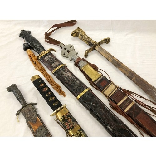 146 - Group of five assorted mainly eastern swords and knives etc, incl. Greek and Japanese daggers; an As... 