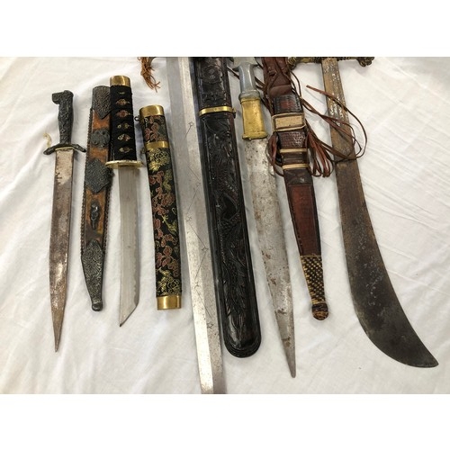 146 - Group of five assorted mainly eastern swords and knives etc, incl. Greek and Japanese daggers; an As... 