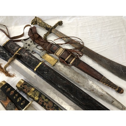 146 - Group of five assorted mainly eastern swords and knives etc, incl. Greek and Japanese daggers; an As... 