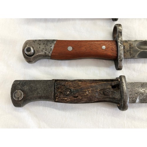 161 - Three knife bayonets, possibly all German-made: one an 1884/98 with blade stamped 3926; two further ... 