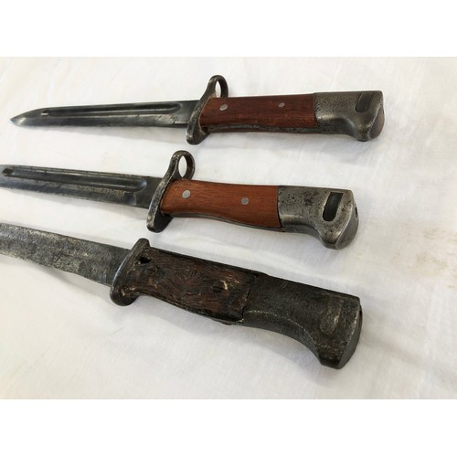 161 - Three knife bayonets, possibly all German-made: one an 1884/98 with blade stamped 3926; two further ... 