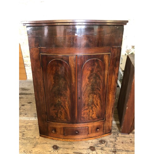 334 - 19th Century mahogany bow fronted wall mounted corner cupboard with shelved interior and single draw... 