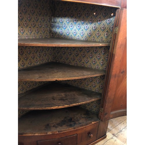 334 - 19th Century mahogany bow fronted wall mounted corner cupboard with shelved interior and single draw... 