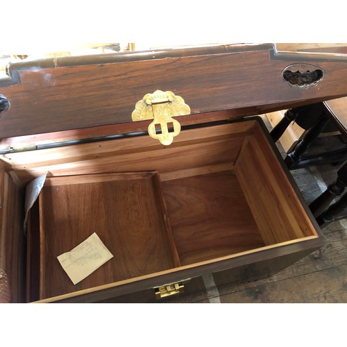 337 - Camphorwood chest with carved junk to the lid and brass locks