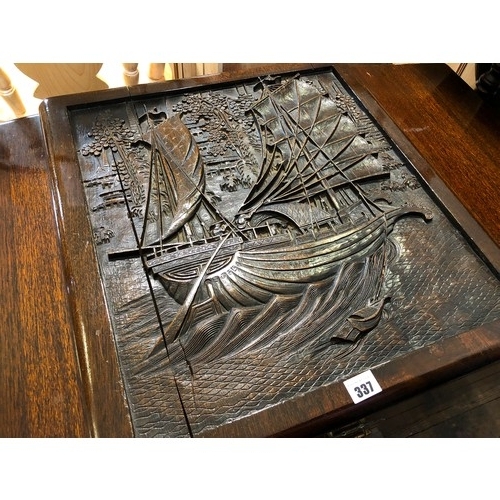 337 - Camphorwood chest with carved junk to the lid and brass locks