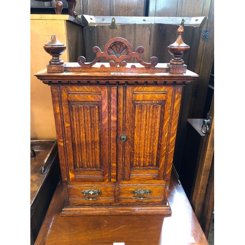 344 - Edwardian oak smokers cabinet with fitted interior and ivorine badge for Army & Navy Stores, and con... 