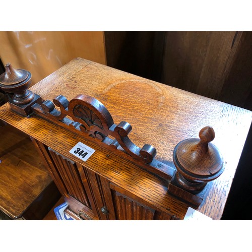 344 - Edwardian oak smokers cabinet with fitted interior and ivorine badge for Army & Navy Stores, and con... 