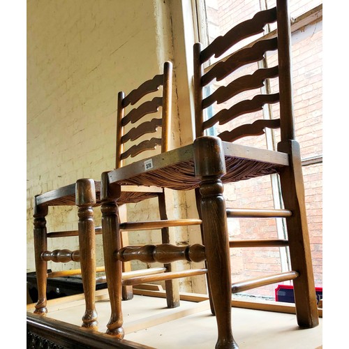 370 - Pair of oak framed ladder back rush seated kitchen chairs