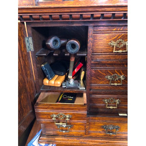 344 - Edwardian oak smokers cabinet with fitted interior and ivorine badge for Army & Navy Stores, and con... 