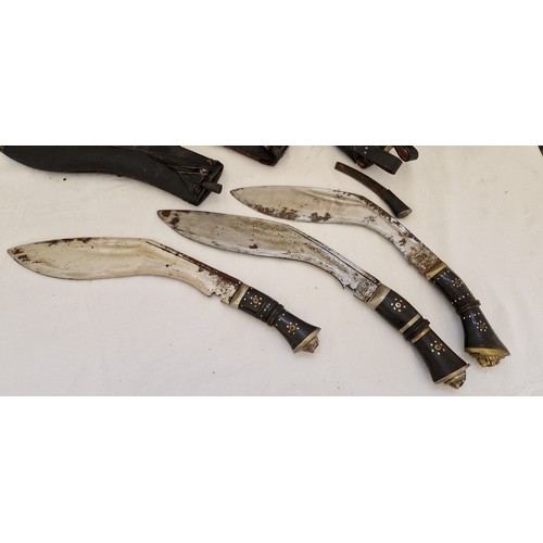 144 - Three Kukri knives with leather sheaths and leather sheath with three small knives