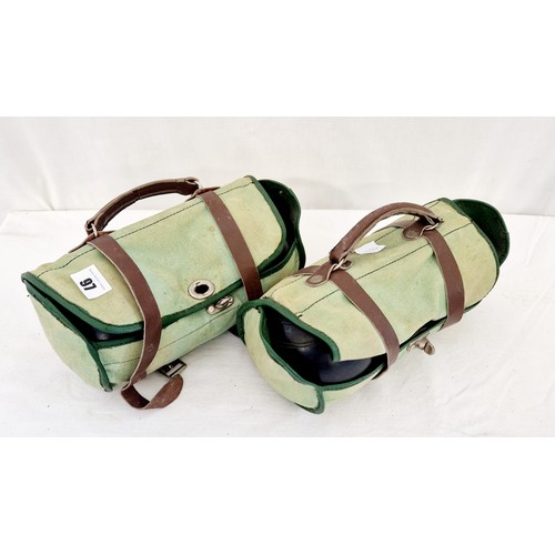 97 - Two bags of vintage ebonised lawn bowls