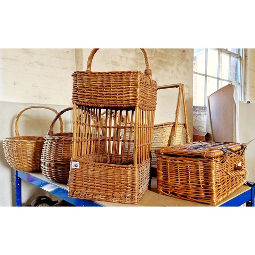 113 - Four various wicker baskets, hamper and two cane magazine racks